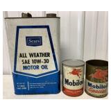 empty Mobiloil and Sears oil cans