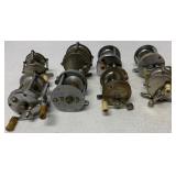 8 fishing reels, some damaged