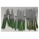 18 green handled knives and forks