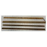 4 advertising yard sticks for milk and seeds