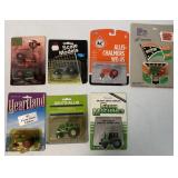 (7) 1:64 scale tractors blister packs
