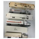 (3) 1:64 scale tractor branded tractor trailers