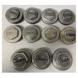 11 Peerless automobile grease hubs