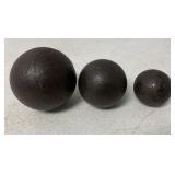 lot of three cannonballs
