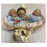 Triplet boy dolls in basket