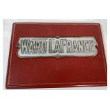 Ward LaFrance name plate on wood