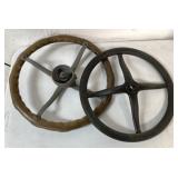 two wood and metal steering wheels