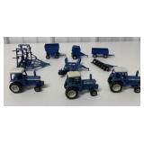 (9) 1/64 Ertl Ford Tractors and farm implements