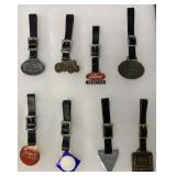 8 tractor themed watch fobs in Riker display case