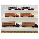 6 miniature plastic tractor trailers