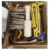 caulk gun, hammers, knife, levels, rules, etc.