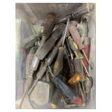 tote of screwdrivers, tape measures, etc.