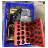 crate of screws, O-ring kit, and dolly wheel