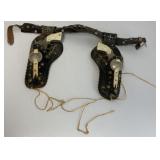 pair of Gene Autry cap guns in gun belt