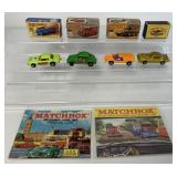 8 Matchbox cars(4 in boxes) and 2 catalogs
