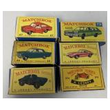 6 Matchbox vehicles in boxes