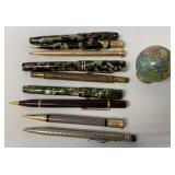 9 assorted pens and pencils + globe sharpener