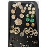 lot of bracelets, ear rings and pins