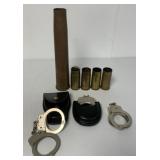 3 pair handcuffs & 5 brass shell casings