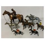 7 metal horses with jockeys