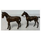 two small bronze horses marked JB