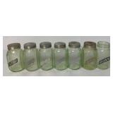 7 green glass spice jars