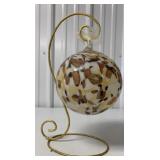 large glass ornament on stand