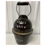Brown Jug Apple Brew 1923 Written on it