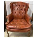 wingback tufted leather armchair