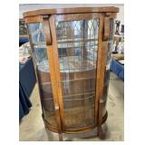 lighted oak bow front cabinet w/4 glass shelves
