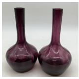 2 purple glass vases