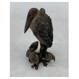 painted brass bird and her young