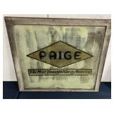 Paige automobile decal on garage window