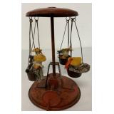 hand crank tin carousel swings w/dolls