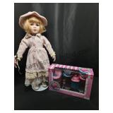 Porcelain Doll & Tin Tea Set