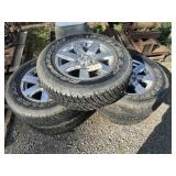 SET OF USED JEEP TIRES AND WHEELS