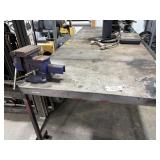 Large metal table with vise