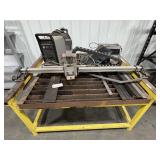 Plasma cutter, table, and contents