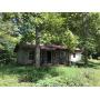 7.2 Acres w/Neglected Home