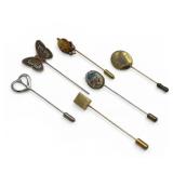 Six old stick pins