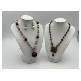 2 lucite ball necklaces, one w/ earrings