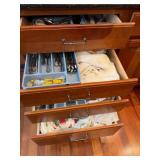 kitchen drawers under sink lots of flatware