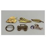 6 brooches