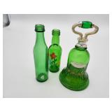3 small green glass bottles