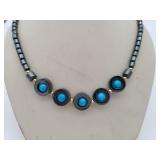 Blue necklace with metal gray beads