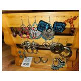 Group of earrings with wooden stand