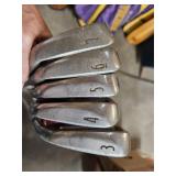 Group of 5 golf clubs