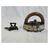 2 Vintage Cast Iron Sad Irons with Trivets