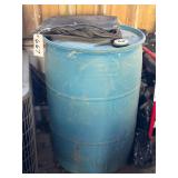 Barrel of Liquid and Tarp