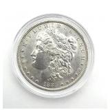 1885-O Morgan Dollar in Hard Plastic Case- case